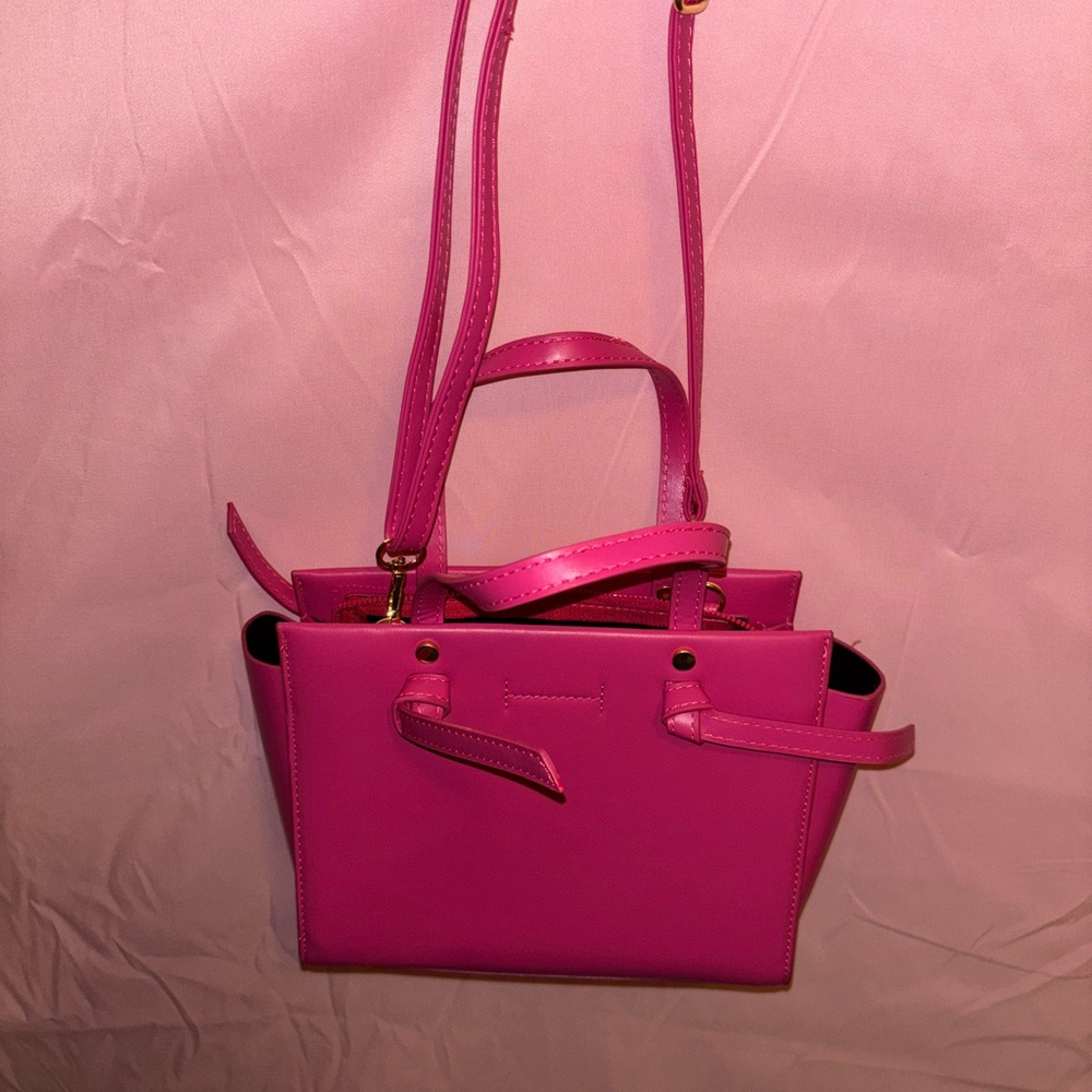 Pink Crossbody Bag with Structured Design and Versatile Straps